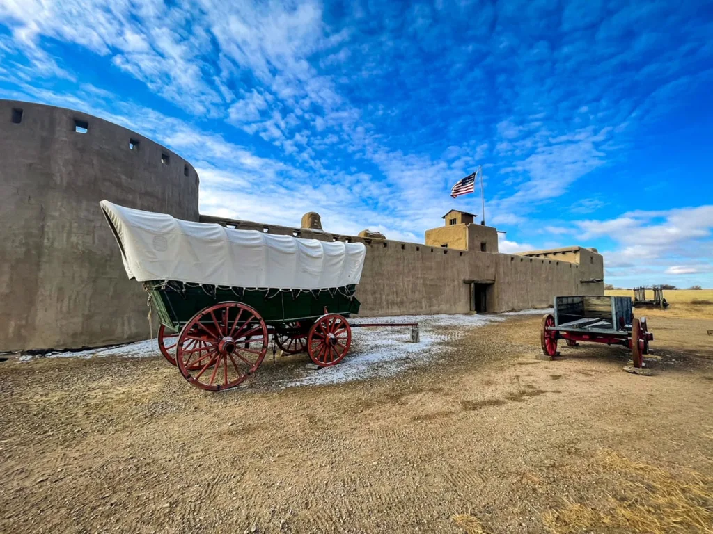 View of a Cannon and Wagon on the Outside of Bents Fort Colorado